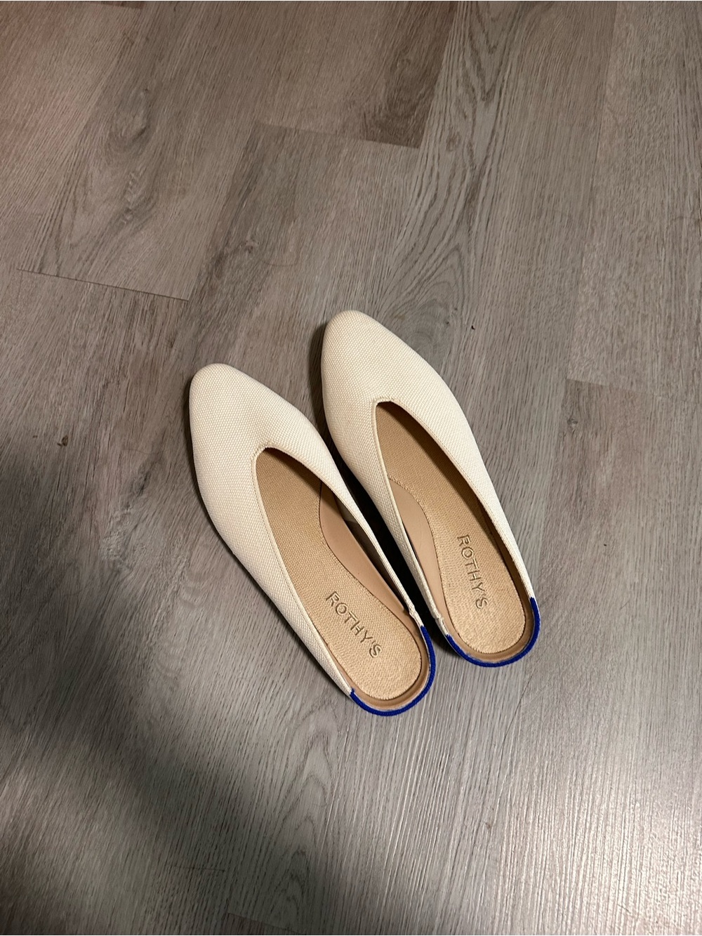 Rothy's Cream Pointed Flats with Blue Heel Accent